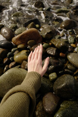 hand on the rocks