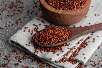 Red quinoa grains. Healthy vegan food concept. Chenopodium quinoa.