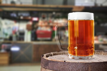 Pint glass of beer in bar on the desk