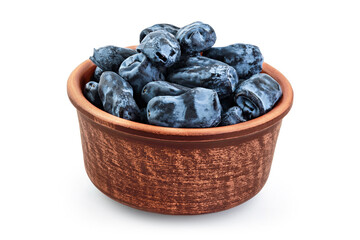 Fresh honeysuckle blue berry in ceramic bowl isolated on white background with full depth of field