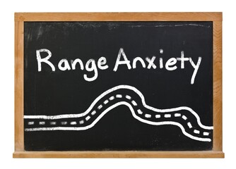 Range Anxiety written in white chalk on a black chalkboard isolated on white