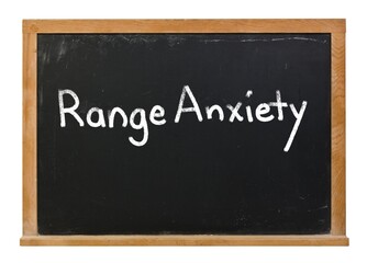 Range Anxiety written in white chalk on a black chalkboard isolated on white