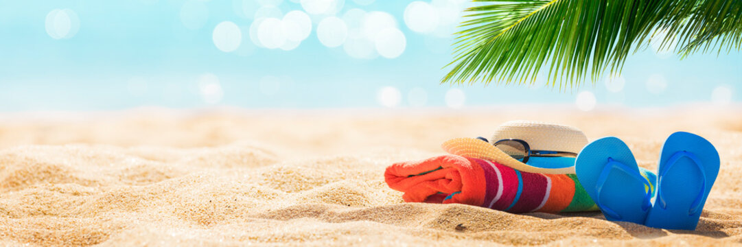 Summer Holiday Background With Flip Flops And Palm Tree On Sandy Beach