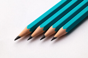 A set of pencils on a paper background. Close up. Macro.