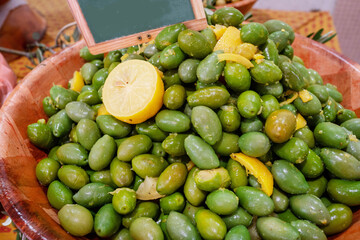 Large salted olives "Bella di Cerignola" with lemon flavor is an autochthonous variety of olives that grows in the Apulia region (Italy) in the Cannes market.