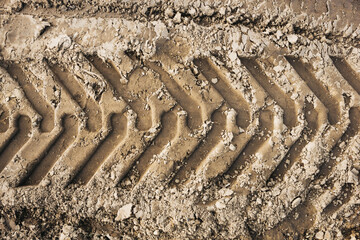 Sand tyre mark background. Tire track shape. Trail lines on dry brown sand pattern. Road...