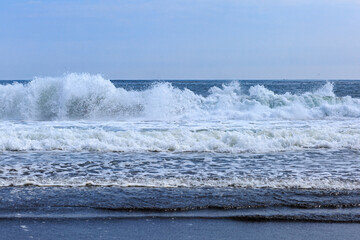 Pacific coast, big waves, volcanic black sand, Kamchatka.