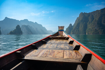 Fototapeta premium Boat view of epic limestone cliffs at Cheow Lan lake, Khao Sok National Park, Suratthani, Thailand