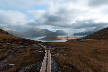 Hiking trail in Norway with lake ocean background