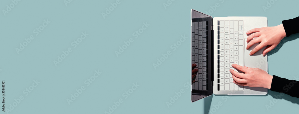 Sticker person using a laptop computer from above