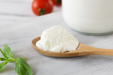 Homemade Yogurt with cream in a wooden spoon, healthy food