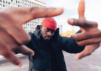 Urban Hype - Wide-Angle Portrait of an African Man of Hip-Hop Street Style Culture in City
