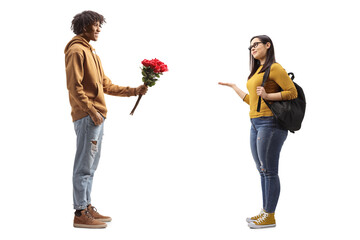 Young african american man giving red roses to a female student