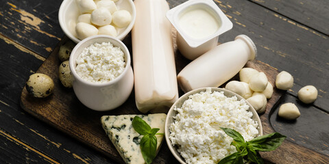 Different dairy products on wooden table
