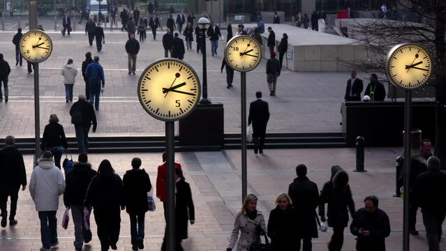 London docklands clocks with people