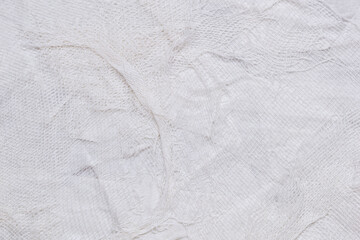 Textured handmade white textile background with mesh and paper base. Horizontal background handmade for design