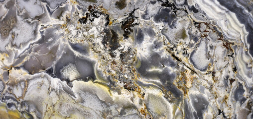 Texture of a colorful natural stone with layer structure as a background