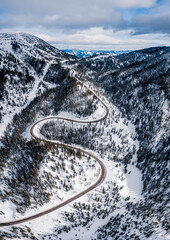 winding mountain pass road in winter