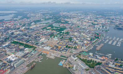 Helsinki Downtown Cityscape, Finland. Cathedral Square, Market Square, Sky Wheel, Port, Harbor in Background. Drone Point of View