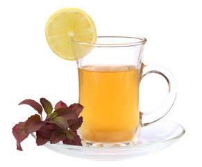 Cup of herbal tea with red tulsi leaves and lemon