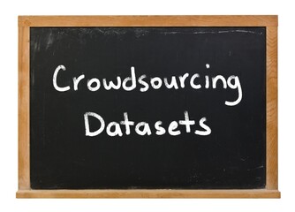 Crowdsourcing datasets written in white chalk on a black chalkboard isolated on white
