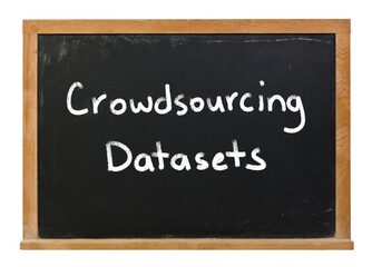 Obraz premium Crowdsourcing datasets written in white chalk on a black chalkboard isolated on white