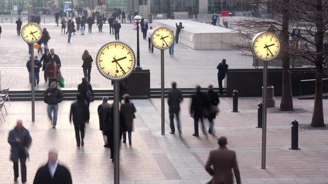 London docklands clocks with people
