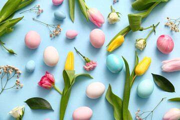 Composition with painted Easter eggs and beautiful flowers on color background