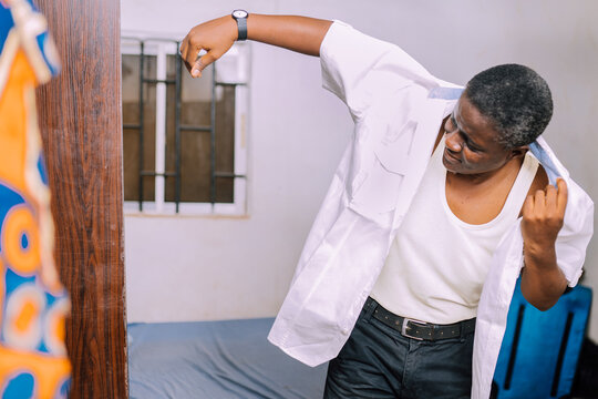 A queer masculine woman dressing up