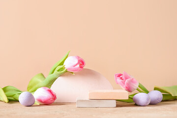 Composition with podiums, Easter eggs and tulip flowers on color background