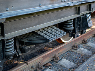 Huge train springs and leaf spring over the wheels. Train wheel system, detail