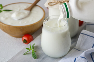 Glass cup of Turkish traditional drink ayran , kefir or buttermilk made from yogurt, healthy food