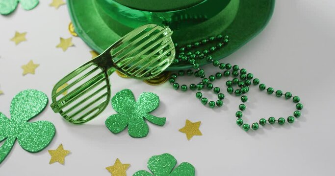 Shamrocks and stars with green hat and glasses with copy space on white background