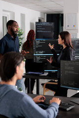Software developer programming source code algorithm on computer, typing sever data in agency...