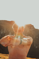 A man stretching his arms after a hard workout in the early hours of the morning