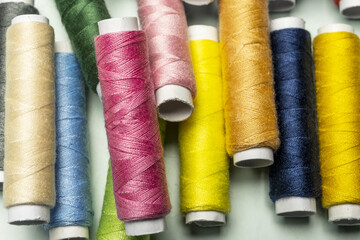 Brand new spools of various colored sewing thread