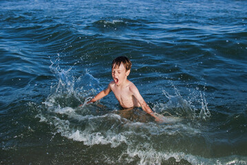 swim, learn to swim, child laughs, waves, splashes, ocean, danger on water