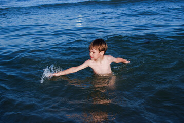 swim, learn to swim, child laughs, waves, splashes, ocean, danger on water