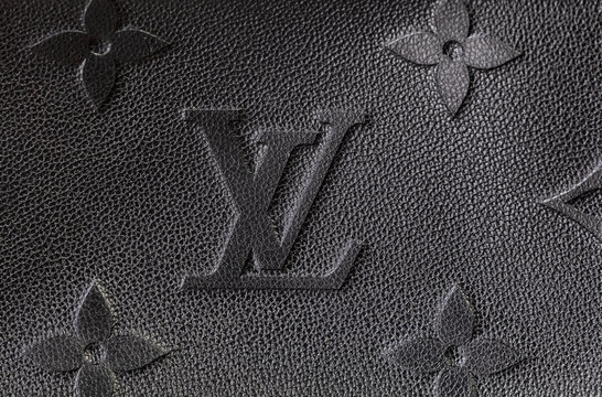 Editorial close up of Louis Vuitton logo on leather handbag