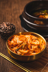 Korean pickle and seasoning Spicy Kimchi Korean traditional food, Kimchi salad made with vegetable cabbage and pepper in golden bowl.