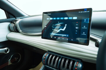 Electric car interior dashboard white touch screen and air condition control system. - obrazy, fototapety, plakaty