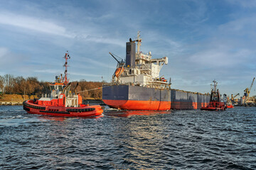 Port of Gdansk, Baltic Sea, A large bulk carrier with a displacement of 81,703 t DWT, built in 2019, enters the port with the assistance of tugboats, the ship is 228.99 meters long, 32 meters wide, an