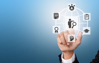 Business hand touching icons on background