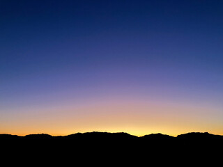 sunset in the desert mountains