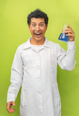 Portrait of a genius scientist happy with his science experiment on a green background. Medical...