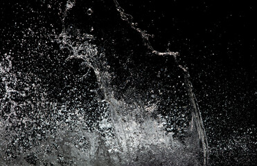 Blur Defocus Image of Water hit wall ground, explode into drop droplet. Amount Water attack impact and fluttering in air explosion. Stop motion freeze shot. Splash Water for texture elements