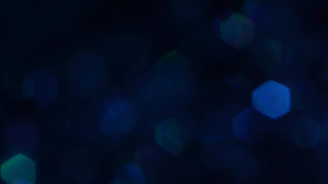 Animated abstract background and fading blue particles designed as a background, texture or pattern concept.