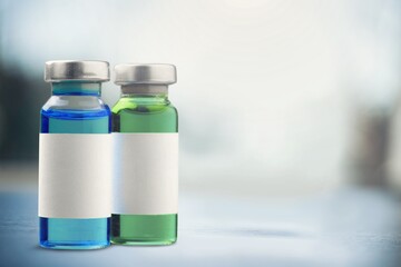 Vaccine medical bottle on desk in blur hospital