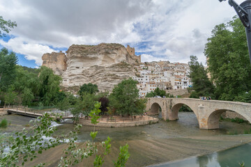 Fototapeta na wymiar Roman bridge over the river Jucar in Alcala del Jucar. Province of Albacete, Spain