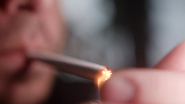 Extreme Close-up of Cigarette Ignition, Hazards of Smoking Concept